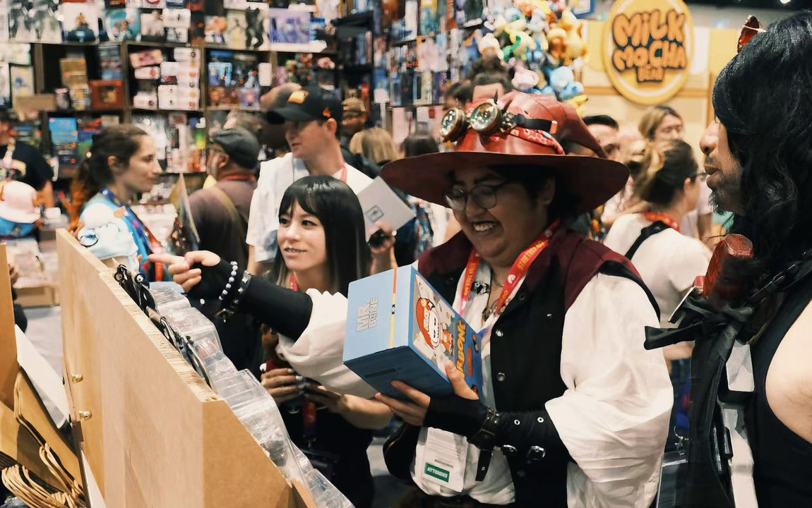 Cosplayer holding a Mr.Bone box at SDCC