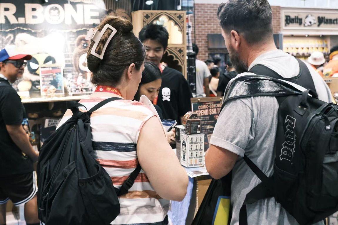 Crowd browsing the Mr.Bone booth, SDCC